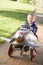 Young boy playing outdoors in airplane smiling