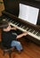 Young boy playing piano