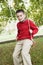 Young boy playing on tree swing