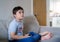 Young boy playing video games online, Candid shot Happy mixed race child sitting on sofa holding game console. Portrait  kid face