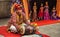 Young boy plays dholak a traditional music instrument with puppet show at Jaipur, Rajasthan, India