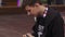 Young boy pour liquid into electronic cigarette on street. Vaper. Smoker. Steam