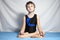 Young boy practices yoga
