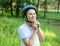 Young boy in puts on helmet in park. Smiling cute boy on bicycle in the forest. Active fun healthy outdoor sport for children.
