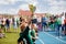 Young Boy Raising Golden Football Cup. Winning Youth Football Team Celebrating Success