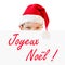 Young boy in red Santa hat and Joyeux Noel