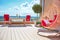 Young boy relaxing in hammock on modern rooftop patio, home terrace