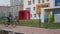 Young boy riding a bike in front of the colorful building