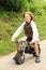 Young boy riding small motorbike