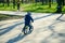 Young boy riding strider bike