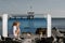 Young boy on sea rocks in smartphone`s frame