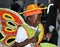 A young boy shaking the cowbells in the junior Junkanoo parade in The Bahamas