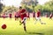 Young boy shooting soccer ball