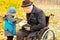 Young boy showing his grandfather his tablet