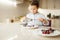 Young boy shows sandwiches with melted chocolate