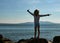 Young boy silhouette on sea beach