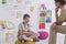 Young boy sits on a yellow pouf