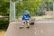 Young Boy with Skateboard Sitting on Ramp