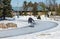 Young boy skating on an icy trail