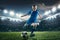 Young boy with soccer ball doing flying kick at stadium