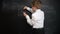 Young boy solving maths expression on a blackboard. Creative concept of back to school and study. Pre school