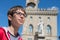 Young boy spectacled looking up outdoor over San Marino city-state. Vision, eyesight, sight, diopters, spectacles, glasses