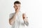 Young boy with a surprised unhappy failure expression bet slip on studio background.