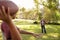 Young boy throwing American football to his dad in park