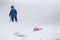 Young Boy tired of Shoveling Snow in a Blizzard Drops his Shovel and Walks Away