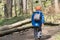 Young boy trecking in a forest