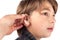 Young boy trying a hearing aid. Isolated on white background