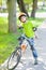 Young boy trying to ride bicycle