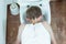 Young boy vomiting into a toilet bowl
