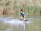 Young boy wakeboarding