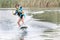 Young boy wakeboarding