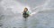 Young boy wakeboarding