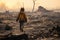 the young boy walks through the burned area of the city