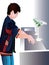 A young boy washing his hands