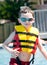 Young boy wearing flotation device