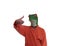 Young boy wearing a green frog animal mask with orange bathrobe with surfing hand gesture with pinky and thumb on white background
