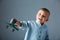 Young boy with wooden airplane