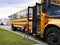 Young boy and yellow school bus