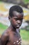 Young Boys of Benna Tribe with Traditional Body Painting on the Long Wooden Sticks posing for the picture