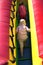 Young boys climbing inflatable bouncy