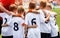 Young Boys In Football Team. Group Of Children In Soccer Team. School Football Coachâ€™s Pregame Speech