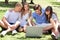 Young boys and girl students using laptop