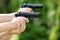 Young boys practice shooting guns on outdoor