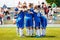 Young boys sports team on stadium. Young football players in sportswear