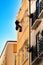 Young bricklayer climber doing repair work in a facade of Lisbon