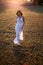 Young bride posing alone in the field